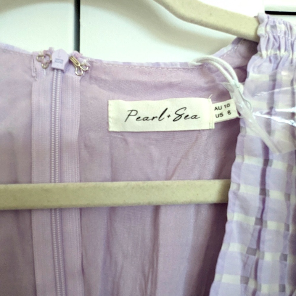 NWT Never Worn beautiful Kenzi Mini Dress in Lilac. Perfect for the spring!